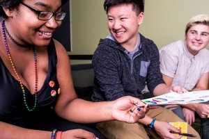 Students laugh while attending a youth summit for LGBTQ youth.
