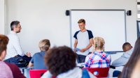 High school student making presentation in class