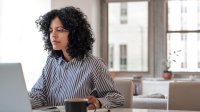 Woman working on laptop at home