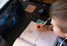 Boy completing math lesson via video chat during distance learning