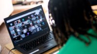 Teacher conducting a video group chat with her students during distance learning