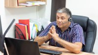 Teacher on zoom call.