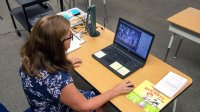 A California elementary school teacher takes attendance of her virtual distance learning class