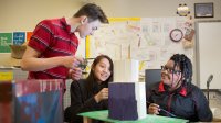 High school students build a speaker together