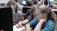 Teacher is working with the students in a classroom