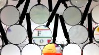 Several magnifying glasses laying flat on a surface
