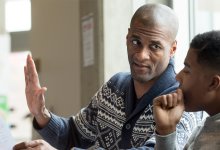 Teacher working with high school student 