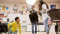 Students rehearsing a play in a high school drama class