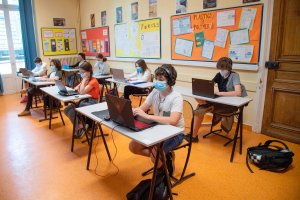 Teenagers wearing protective face masks are seen studying during a class day as middle school reoppened in France on June 2nd, 2020