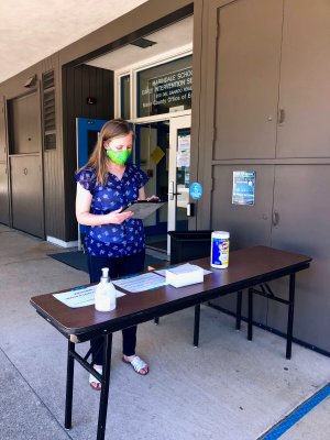 Ashley Wooldridge, a preschool teacher, manages the check-in table at Marindale Preschool in San Rafael.