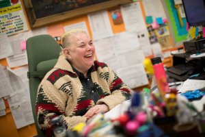 Principal Ava Kaplan sits at her desk at P186X.