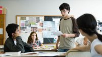 Student reads to his class