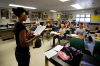 Middle school student speaking in front of her science class