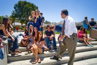 School principal talking to students outside