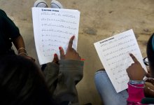 Two students reading sheet music