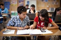 Two high school students work together in math class