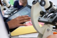 Student using a tablet in science class