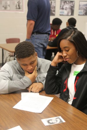 A boy and girl discuss a project on Selma in Jessica Dickens' class. 