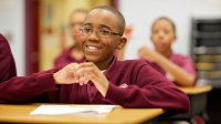 Students sitting at their desks in a middle school classroom