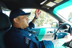 Officer Ron Singh in patrol car.