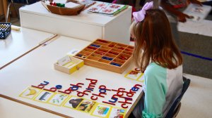 Girl working on spelling in class at elementary school.