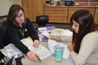 Teacher discussing work with a student