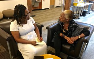 Teacher Shonda Dawson gets feedback from SNCC veteran Jennifer Lawson on her lesson.