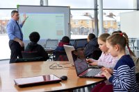 Students coding on their computers