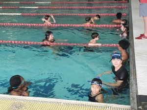 Westdale middle school swim team swimming at championship meet
