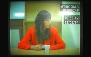 A still of a woman being questioned from the video game, Her Story.