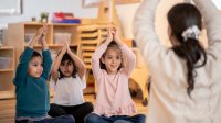 Preschool children doing yoga