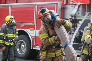 A student participates in a field experience with Lake Country Fire and Rescue.