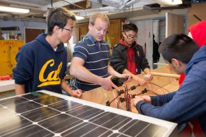 Students in the Green Energy Pathway build a solar powered boat for an upcoming race.