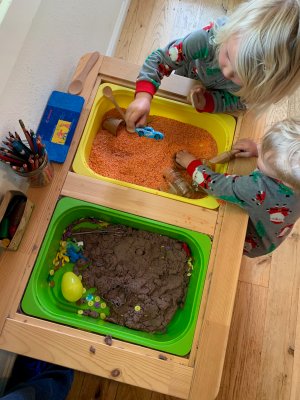 Children play with kinetic sand.
