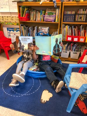 Photo of two students reading books