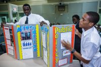 Two high school students give a presentation on public policy