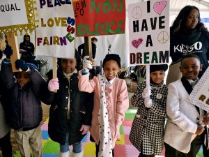 Melissa Collins' students march in a MLK Day parade.