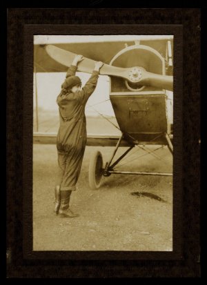 Neta Snook adjusts the propellers of a plane. 