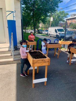 Students play in an outdoor garden in Newark, New Jersey.