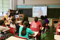 Classroom participating in a video chat via DreamWakers