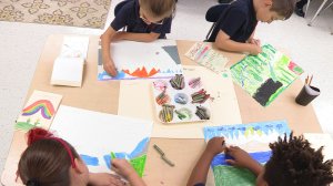 Elementary school students work on art projects at String Theory, a charter school that prioritizes arts, music, and dance.