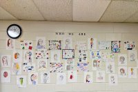 A wall of identity portraits in Shana White's classroom.