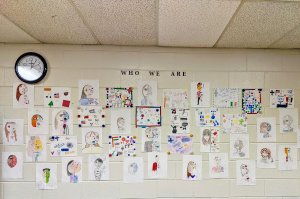 A wall of identity portraits in Shana White's classroom.