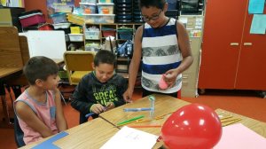 Three boys doing a STEM activity