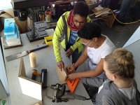 A photo of 3 high school girls working in the makerspace.