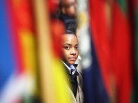 Girl looking through flags