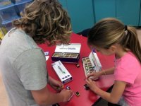 Two girls exploring with littleBits circuits