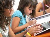 photo of students with tablets