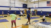 Students completing an obstacle course in gym class