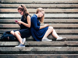 Two Students on Their Devices